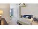 A creative bedroom with stylish furnishings, fan, and natural light at 32859 Pez Landing Ln, Wesley Chapel, FL 33543