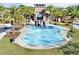 Community splash pad with water features, palm trees, and seating areas at 32859 Pez Landing Ln, Wesley Chapel, FL 33543