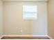 This cozy bedroom has laminate flooring and natural light creating a peaceful retreat at 4218 E Paris St, Tampa, FL 33610