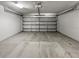 Clean and spacious garage interior with an automatic door at 7415 Terrace River Dr, Temple Terrace, FL 33637