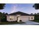 Charming single-story home featuring a well-manicured lawn and attached two-car garage at 25138 Calusa Dr, Punta Gorda, FL 33955