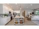 Open floor plan featuring a large kitchen island with countertop dining and stainless steel appliances at 25138 Calusa Dr, Punta Gorda, FL 33955