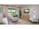 Comfortable living room with neutral tones and view to the back patio at 25138 Calusa Dr, Punta Gorda, FL 33955