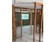 Renovation-ready interior with framed openings and tile flooring at 4906 W Cleveland St, Tampa, FL 33609