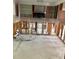 Renovation-ready interior featuring open cabinets and tile flooring at 4906 W Cleveland St, Tampa, FL 33609