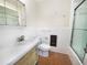Cozy bathroom featuring a vanity sink, toilet, and glass shower stall at 513 Flamingo Dr, Apollo Beach, FL 33572
