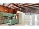 Unique kitchen with wooden beam ceiling, stainless appliances and island at 513 Flamingo Dr, Apollo Beach, FL 33572