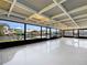 Enclosed lanai provides stunning waterfront views, ceiling fans and creates a seamless indoor-outdoor living experience at 513 Flamingo Dr, Apollo Beach, FL 33572