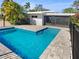 Private pool area with a fenced yard, creating a relaxing outdoor space at 513 Flamingo Dr, Apollo Beach, FL 33572