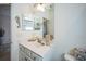 Bright bathroom featuring a neutral color palette, vanity, decorative seahorse and coastal decor at 17936 Polo Trl, Bradenton, FL 34211