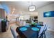 Dining area with an open floor plan, pendant lighting, and seamless flow to the kitchen and living room at 17936 Polo Trl, Bradenton, FL 34211
