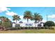 Welcoming community entrance sign for Polo Run surrounded by lush landscaping and palm trees at 17936 Polo Trl, Bradenton, FL 34211