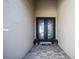 Home's front entrance featuring a tile walkway and double doors at 17936 Polo Trl, Bradenton, FL 34211