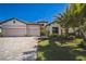 Charming home with a tile roof, three-car garage, and well-manicured landscaping at 17936 Polo Trl, Bradenton, FL 34211