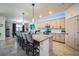 Stylish kitchen boasts granite countertops, seating at the island, and modern pendant lighting at 17936 Polo Trl, Bradenton, FL 34211