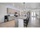 Kitchen featuring a granite island, modern appliances, and easy access to dining and living spaces at 17936 Polo Trl, Bradenton, FL 34211