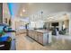 Spacious kitchen seamlessly connects to the living area, complete with a large island and stainless steel appliances at 17936 Polo Trl, Bradenton, FL 34211