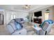 Living room with tile floors, comfortable seating, and entertainment center perfect for Gathering and guests at 17936 Polo Trl, Bradenton, FL 34211