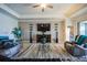 Bright living room with comfortable seating, a large TV, and modern decor for relaxing and entertaining at 17936 Polo Trl, Bradenton, FL 34211