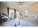Comfortable main bedroom with a seating area, dresser, and modern decor providing a cozy retreat at 17936 Polo Trl, Bradenton, FL 34211