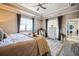 Tranquil main bedroom featuring neutral tones, ample natural light, and comfortable furnishings for restful sleep at 17936 Polo Trl, Bradenton, FL 34211