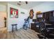 Bright home office featuring wood floors, built-in shelving, and a comfortable workspace at 17936 Polo Trl, Bradenton, FL 34211