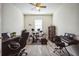 Home office with wood floors, dark desk, rolling chair, and electronic drum set at 17936 Polo Trl, Bradenton, FL 34211