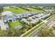 Expansive aerial view of the clubhouse, parking, and golf course at 650 Poinsettia Rd, Belleair, FL 33756