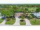 An aerial view of a lovely property showcases a spacious backyard with pool and golf course views at 650 Poinsettia Rd, Belleair, FL 33756