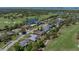 This aerial view shows proximity to the golf course and water views at 650 Poinsettia Rd, Belleair, FL 33756