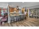 Open kitchen with a bar and modern appliances at 650 Poinsettia Rd, Belleair, FL 33756