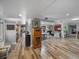 A spacious living area featuring an open floorplan connecting the kitchen and dining spaces, perfect for entertaining at 650 Poinsettia Rd, Belleair, FL 33756