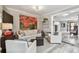 Cozy living room featuring a large flat screen television and neutral color scheme at 650 Poinsettia Rd, Belleair, FL 33756
