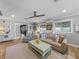 Bright and airy living room with french doors, comfortable seating, and neutral decor at 650 Poinsettia Rd, Belleair, FL 33756
