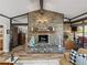 Cozy living room features a stone fireplace with decor and outdoor living access at 650 Poinsettia Rd, Belleair, FL 33756