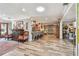 Spacious open-concept living room that flows into the kitchen, complete with hardwood floors at 650 Poinsettia Rd, Belleair, FL 33756