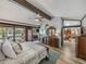 Spacious main bedroom featuring outdoor access, dual closets, and hardwood floors at 650 Poinsettia Rd, Belleair, FL 33756