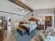 Beautiful main bedroom boasts a walk-in closet, wood beams and plenty of natural light at 650 Poinsettia Rd, Belleair, FL 33756