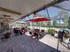 Expansive screened patio with dining and lounge areas, perfect for enjoying the outdoors at 650 Poinsettia Rd, Belleair, FL 33756