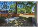Fenced backyard featuring a patio and mature trees offering plenty of shade at 1206 E Hamilton Ave, Tampa, FL 33604