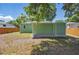 Spacious backyard with a privacy fence and an exterior view of the home at 1206 E Hamilton Ave, Tampa, FL 33604