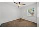 Cozy room with neutral walls and plush carpet flooring provides a blank canvas for personalization at 1206 E Hamilton Ave, Tampa, FL 33604