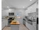 Bright kitchen with stainless steel appliances, butcher block island, and easy access to the back entrance at 1206 E Hamilton Ave, Tampa, FL 33604
