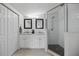 Modern bathroom with dual sinks, walk-in shower, and ample storage for a spa-like experience at 1206 E Hamilton Ave, Tampa, FL 33604