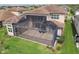 A large screened patio with room for outdoor seating offers a relaxing space at 2709 Coco Palm Cir, Wesley Chapel, FL 33543