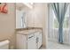 Bathroom with granite countertop, modern sink, and blue curtains at 2709 Coco Palm Cir, Wesley Chapel, FL 33543