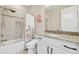 Bright bathroom with granite vanity, shower/tub combo, and modern fixtures at 2709 Coco Palm Cir, Wesley Chapel, FL 33543