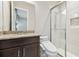 Well-lit bathroom with granite counters, and a modern shower offers convenience and style at 2709 Coco Palm Cir, Wesley Chapel, FL 33543