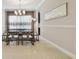 Elegant dining room with modern lighting, stylish furniture, and a sophisticated ambiance at 2709 Coco Palm Cir, Wesley Chapel, FL 33543