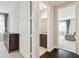 Open hallway leading to bedroom and bathroom with granite vanity at 2709 Coco Palm Cir, Wesley Chapel, FL 33543